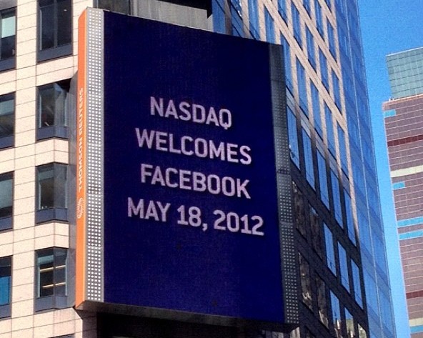Thomson Reuters building billboard welcomes Facebook on Nasdaq.